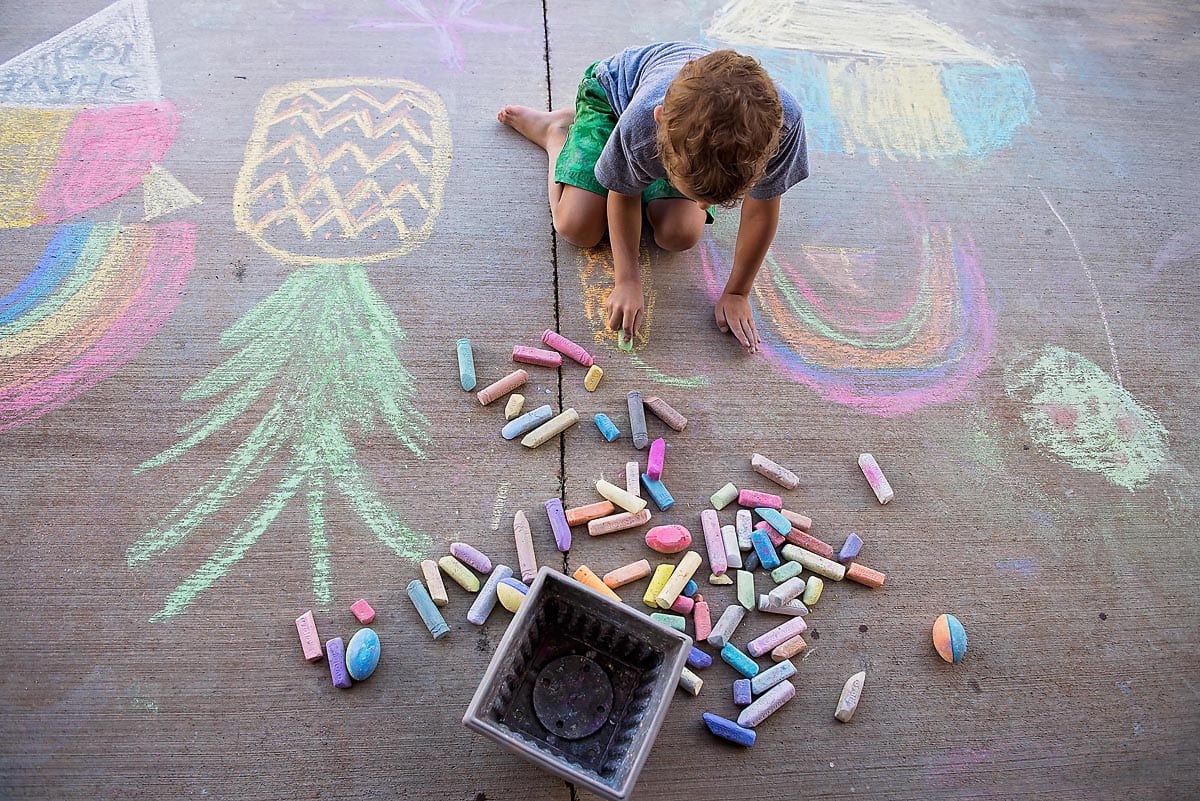 child-drawing-with-sidewalk-chalk-by-Allison-Gipson